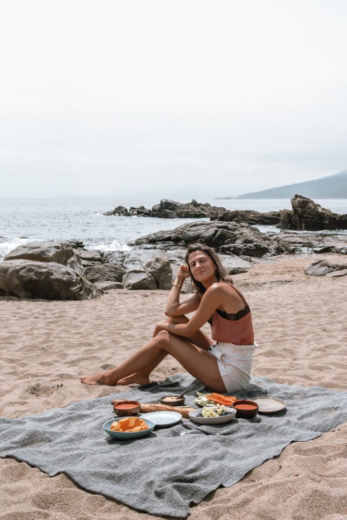 woman on the beach in Chile having a picnic
