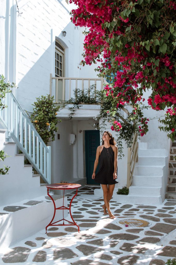 Woman walking in the streets of Paros, Greece