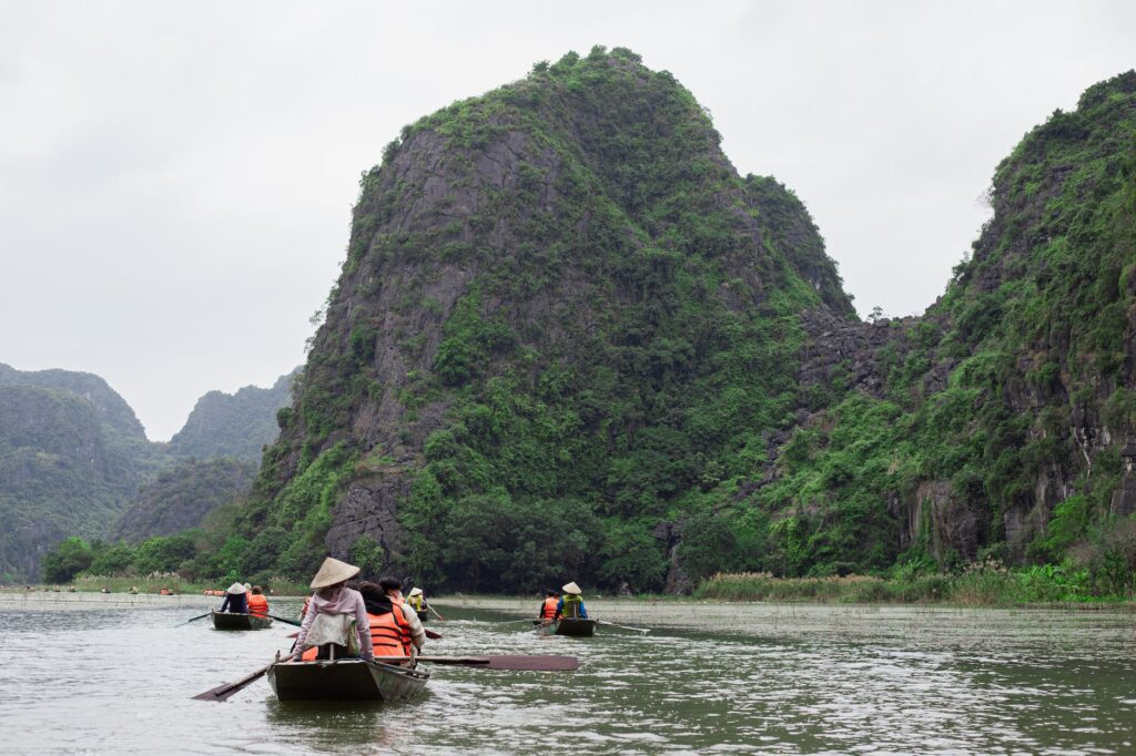 people in boats in ninh binh vietnam
