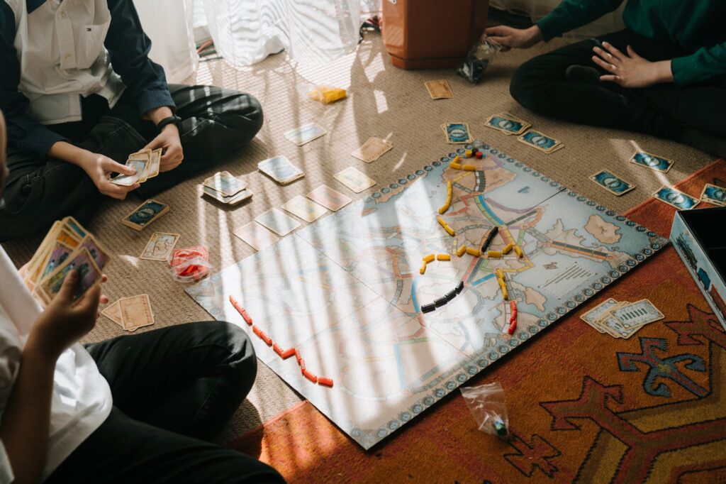 friends playing a board game 