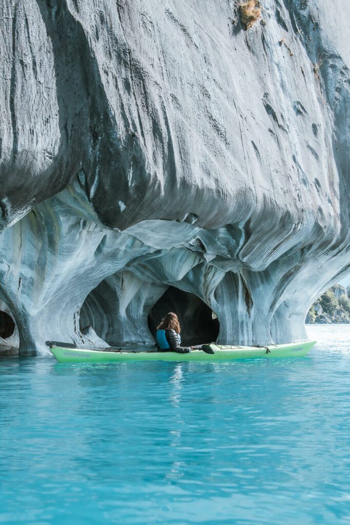 woman kayaking at marble caves chile