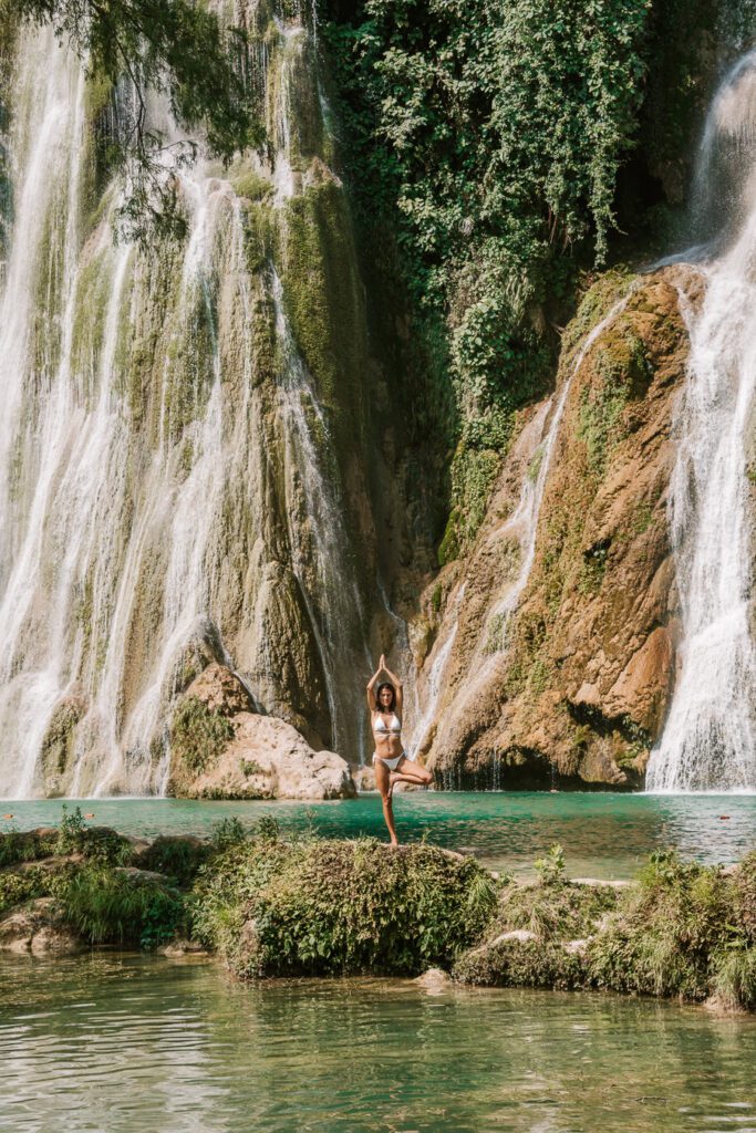 Woman in yoga pose at Minas Viejas waterfall Mexico