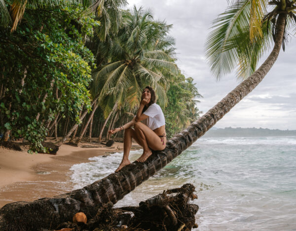 woman on a palm tree in Puerto Viejo