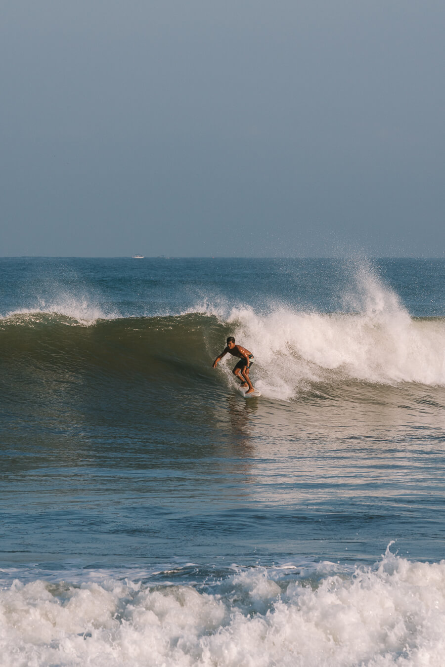 surfer surfing in Sayulita Mexico