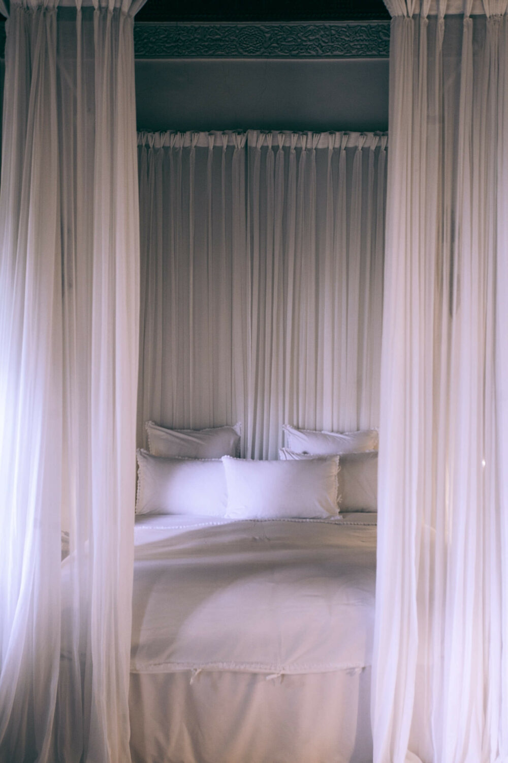 bed with drapes
