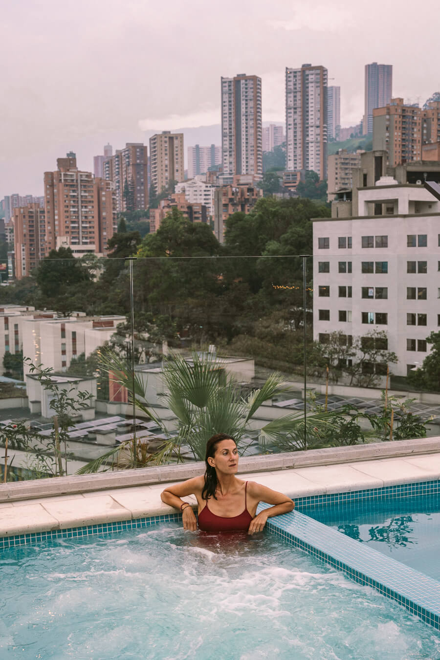 woman in a jacuzzi on hotel rooftop in Medellin