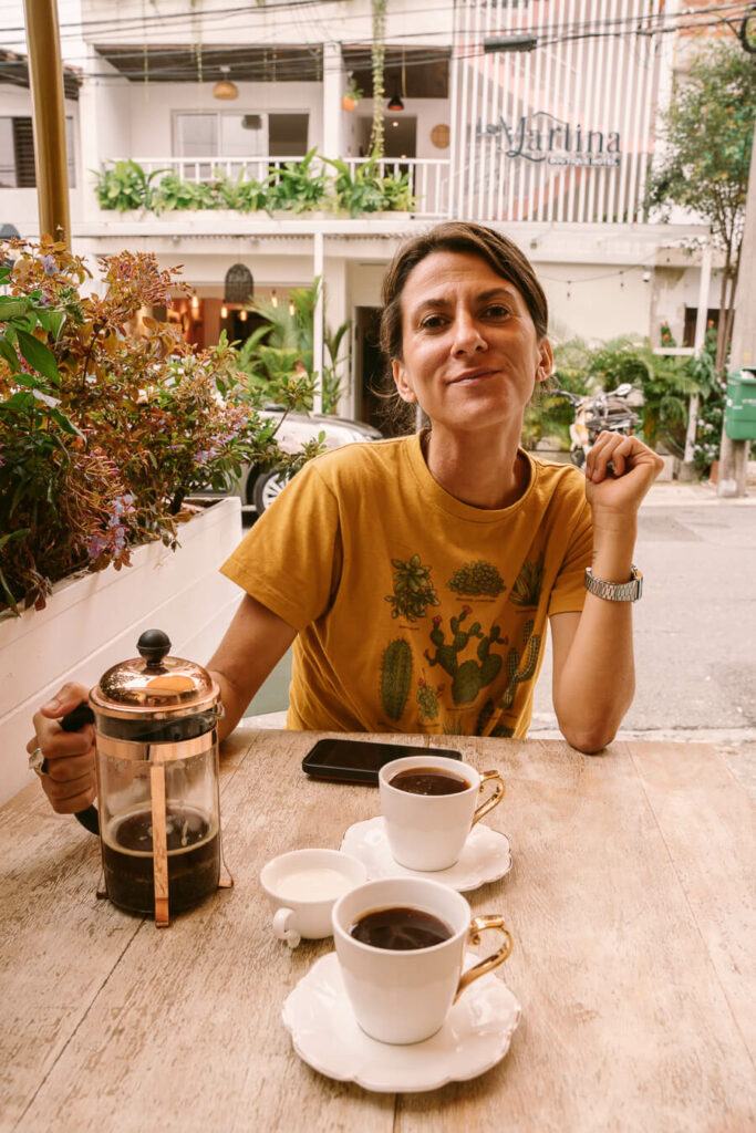 woman drinking coffee in Medellin Colombia