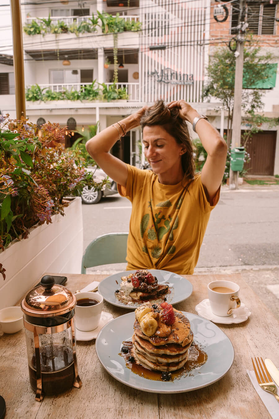woman eating breakfast in Medellin