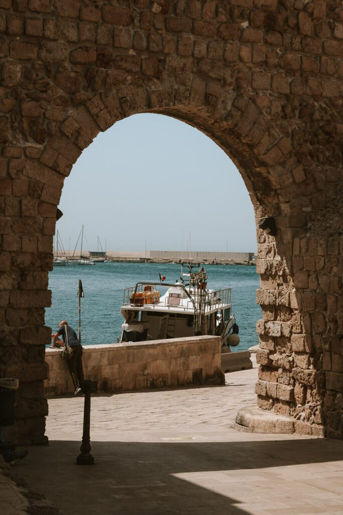 Castle arch and boat in Monopoli Puglia