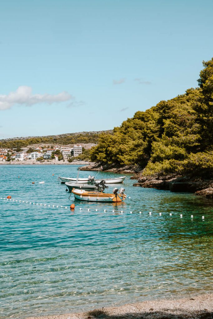 boats on a clear beach in Croatia