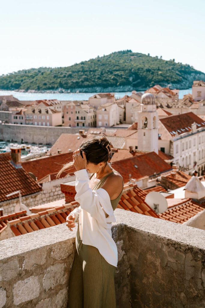woman on the old walls of Dubrovnik during a 7 days in Croatia Itinerary