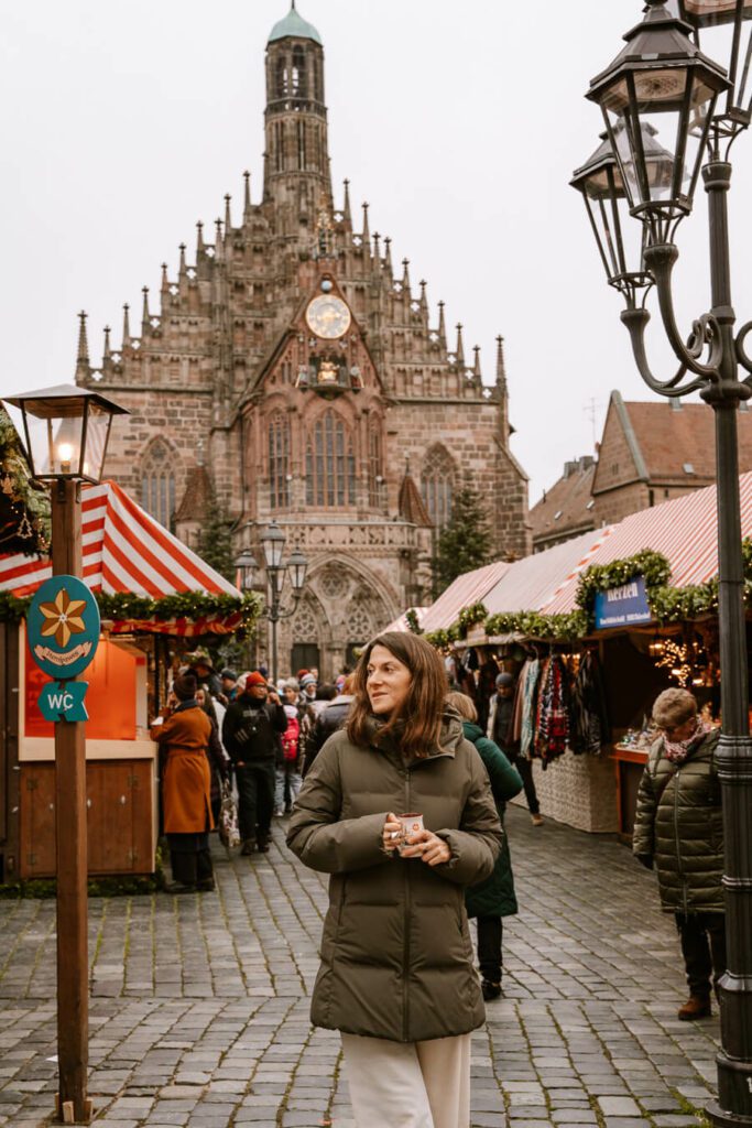 woman with cup of mulled wine at Nuremberg Christmas market, Germany