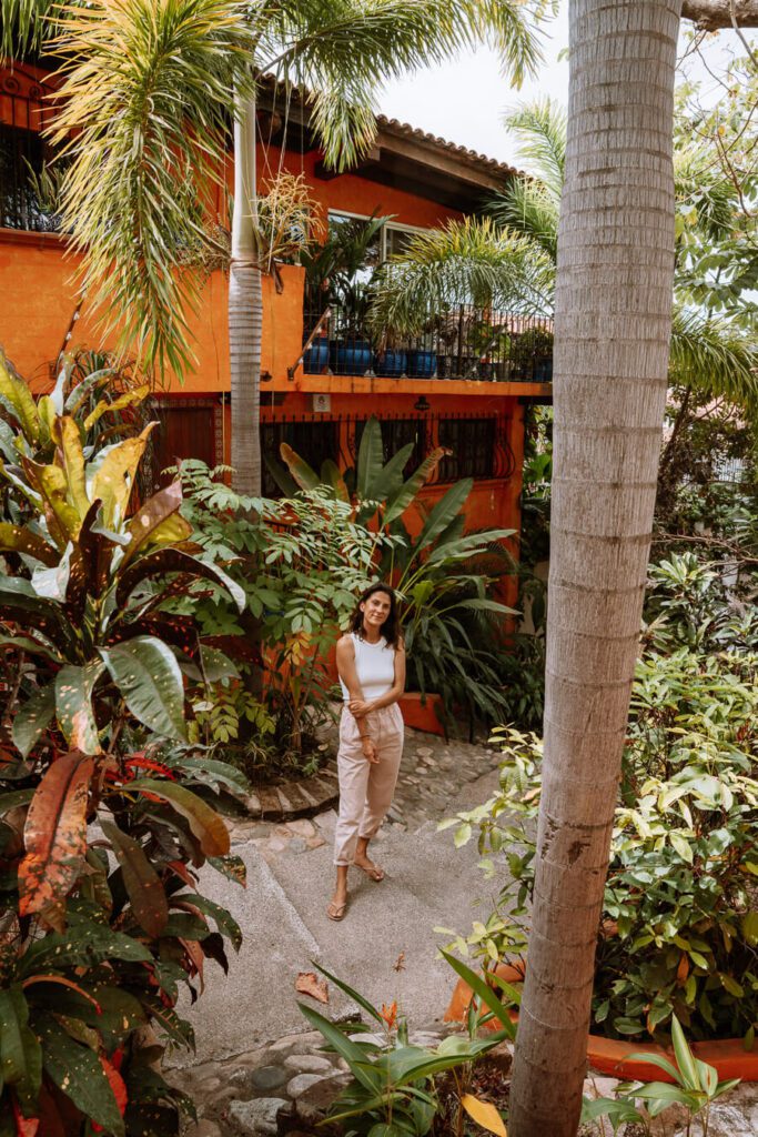 woman by orange house in Puerto Vallarta Mexico