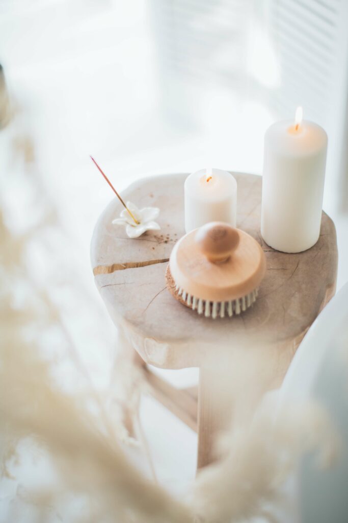 candles and brush on a table