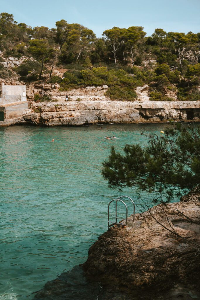 clear water and rocky cove in mallorca, spain
