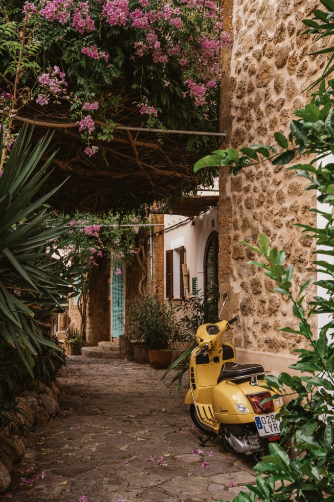 yellow scooter and flowers in Mallorca