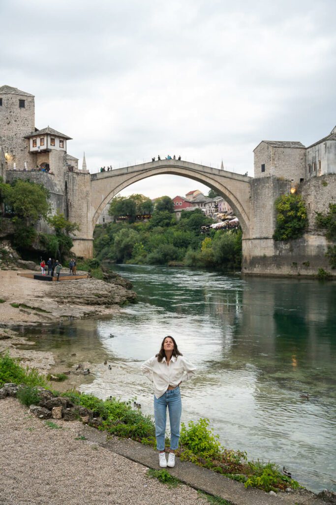 woman next to Old Bridge in Mostar, Bosnia