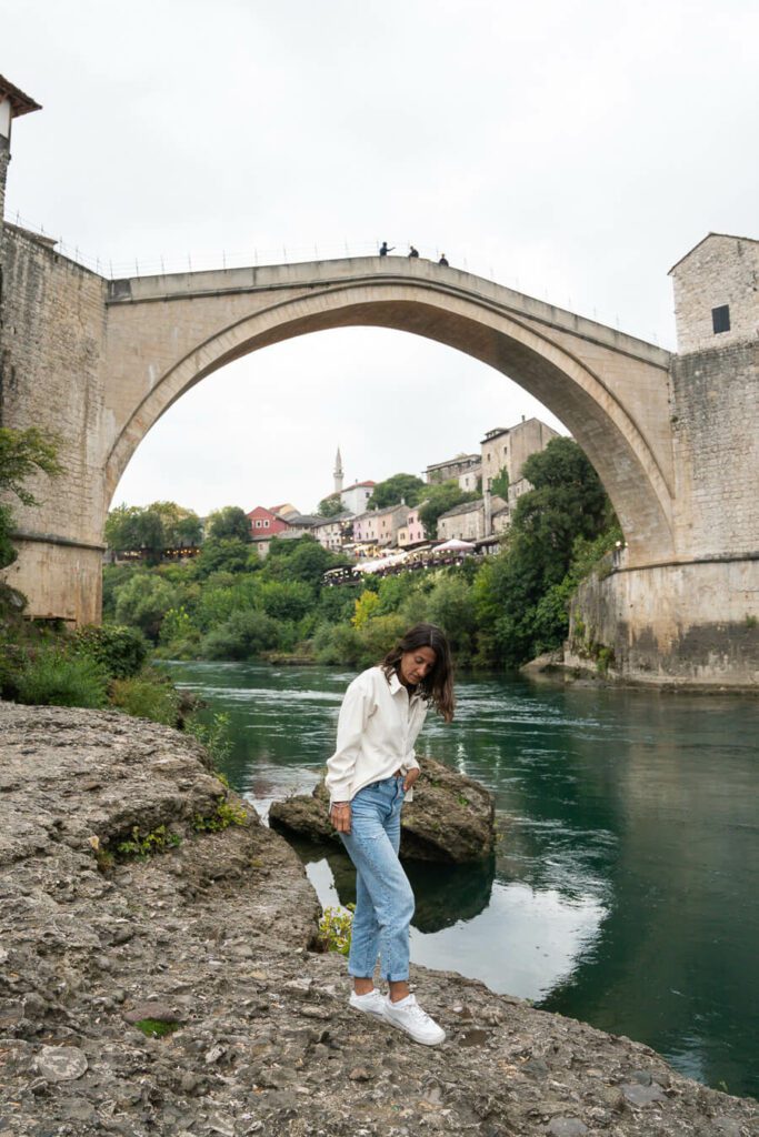 woman under Stari Most in Bosnia