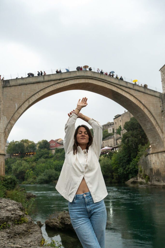 woman under Stari Most in Mostar Bosnia