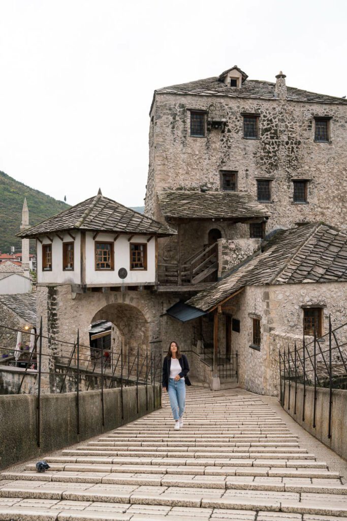 woman walking over Stari Most in Mostar Bosnia