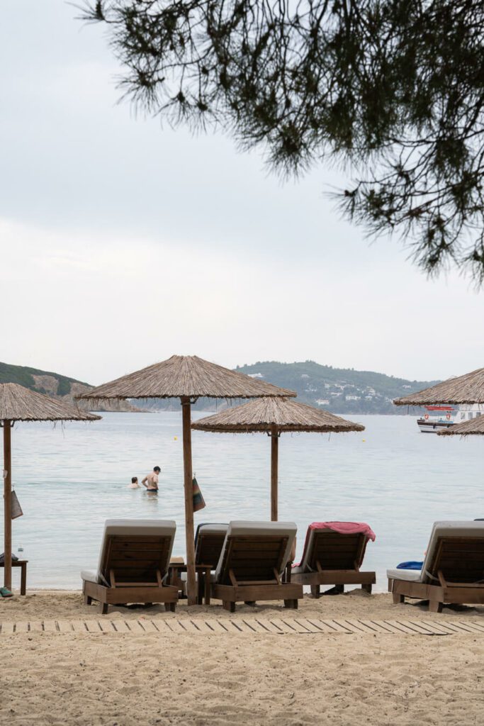 view of sunloungers and the sea in Skiathos, Greece