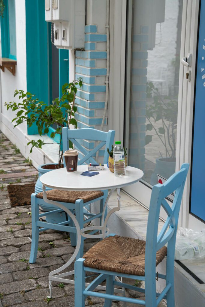 white table and blue chairs in Greece