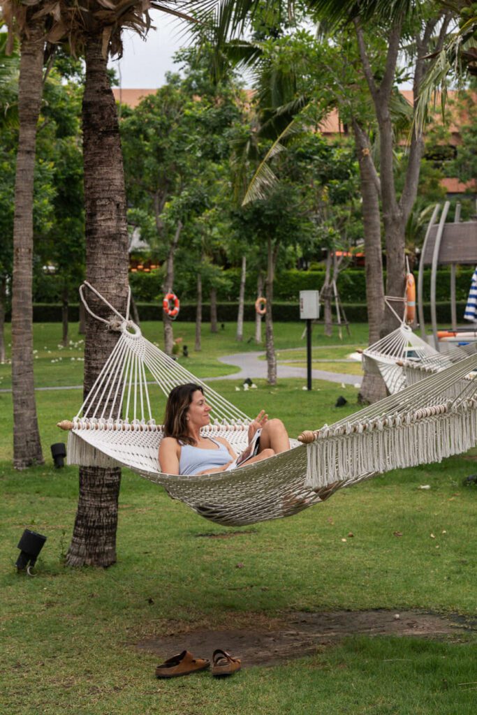 woman in a hammock on a yoga retreat in thailand