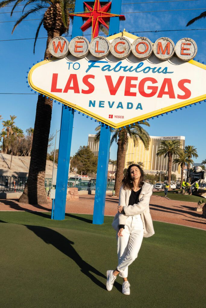 woman at the Welcome to Las Vegas sign, best time to visit las vegas