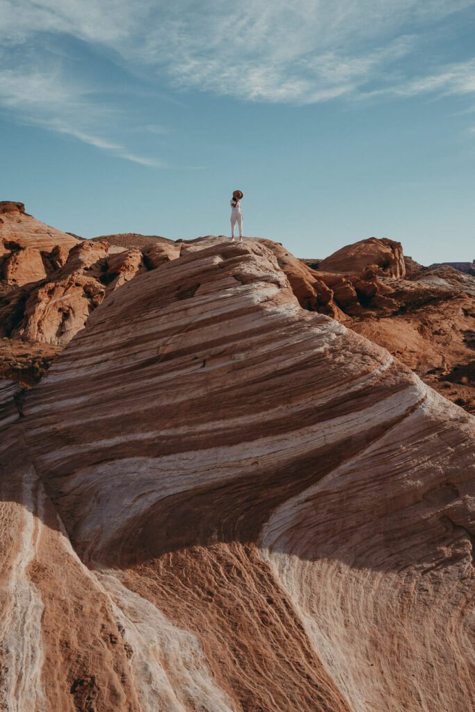 Woman on top of Fire Wave, valley of fire hikes