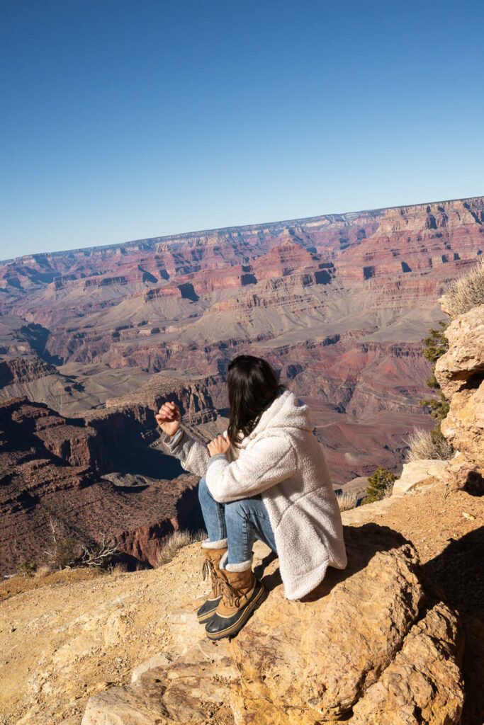 woman admiring the scenery at grand Canyon south rim