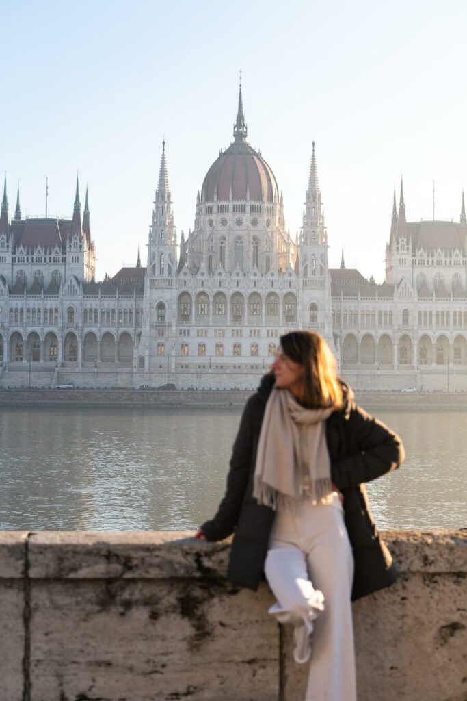 woman in front of Budapest parliament building