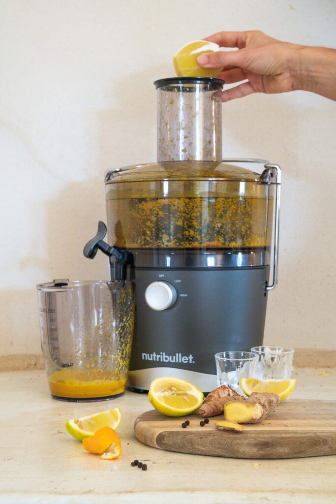 juicer making lemon ginger shots