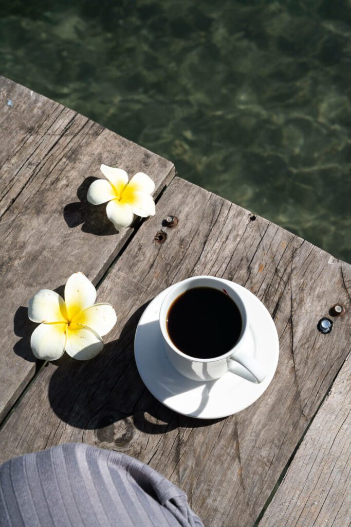 coffee and flower on a pier in San Juan la Laguna Guatemala