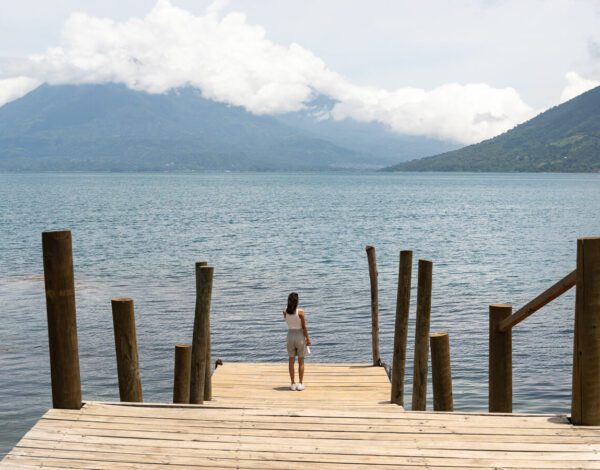 woman on a pier in san marcos la laguna on Lake Atitlan