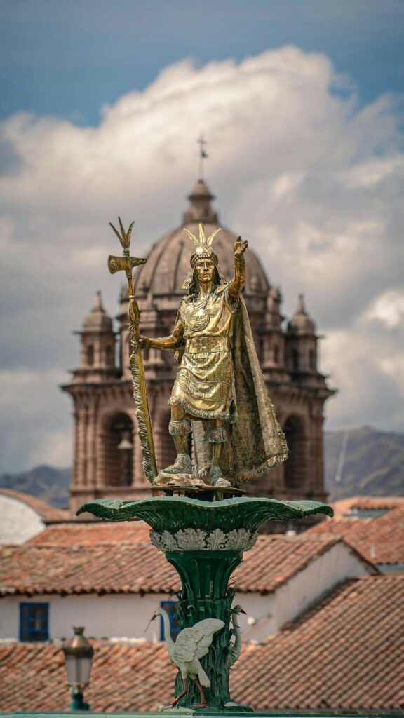 Gold statue of Incan warrior in cusco peru