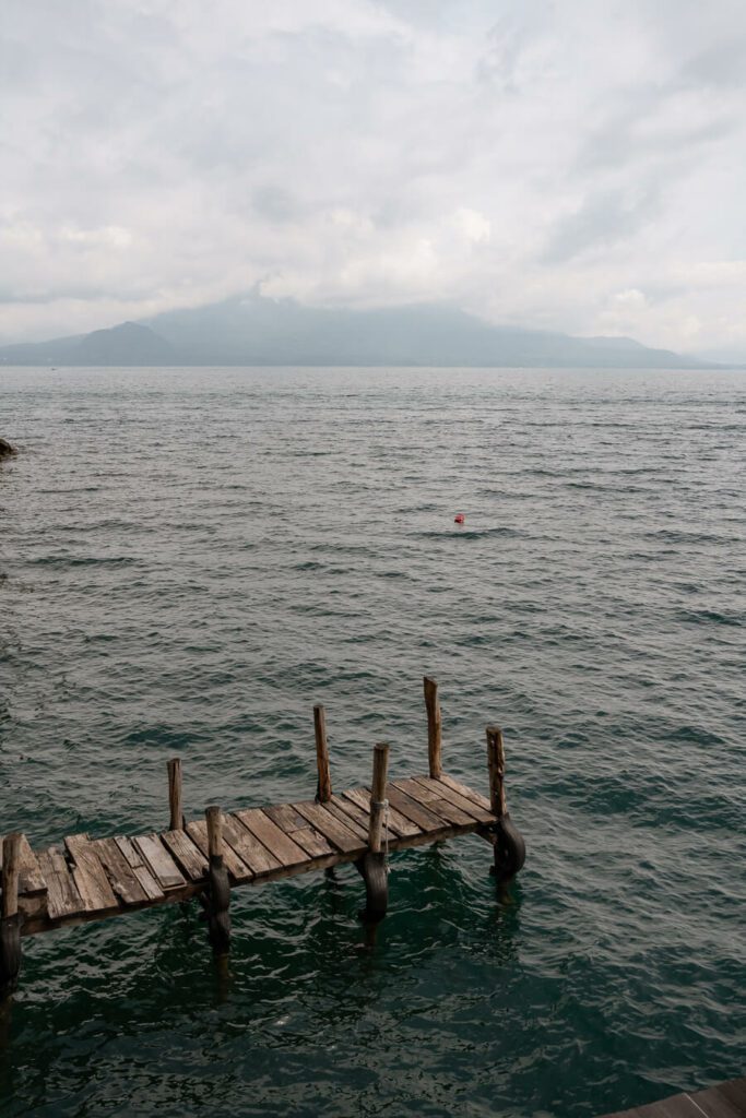 pier with volcano on Lake Atilan during a guatemala itinerary