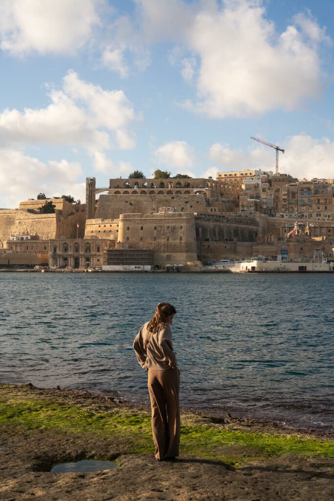 woman with a view of Valletta and harbor