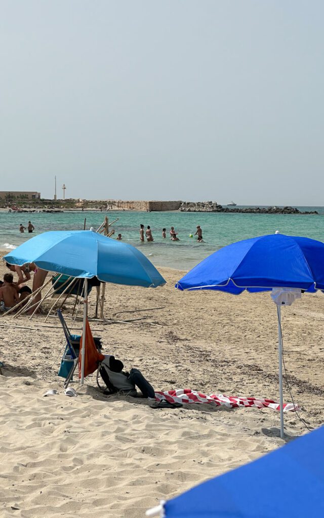 A beach in Puglia with Blue Umbrellas