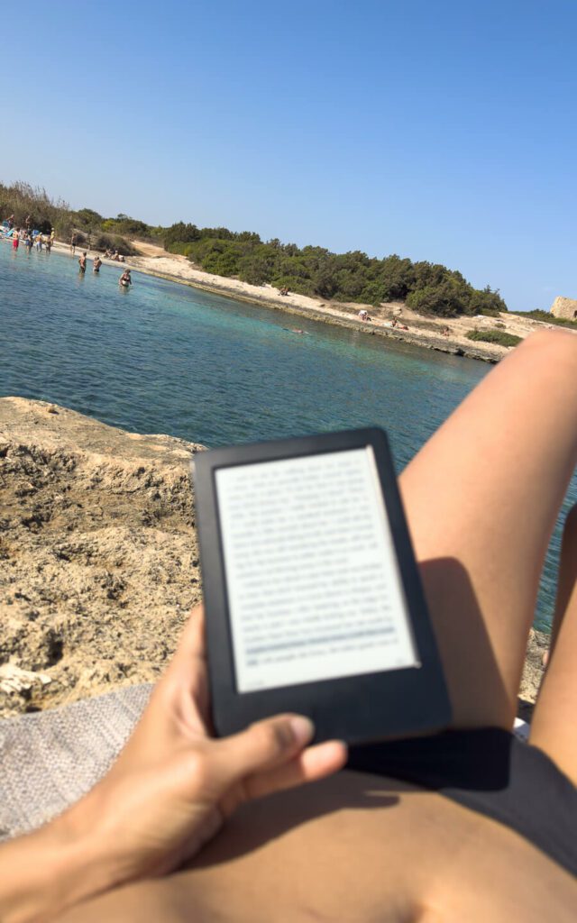 woman reading on the beaches in Ostuni
