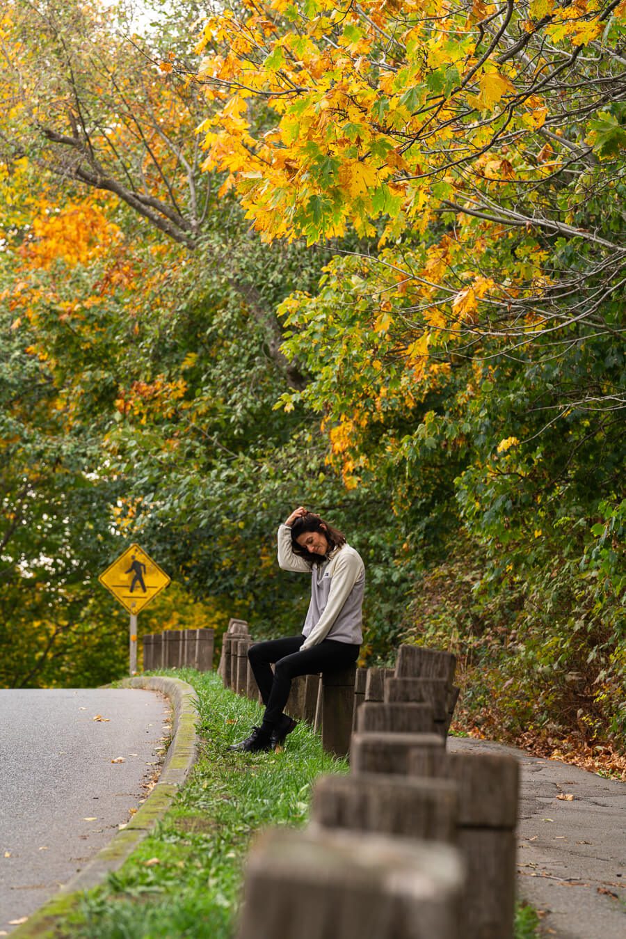 woman in discovery park in seattle in the fall