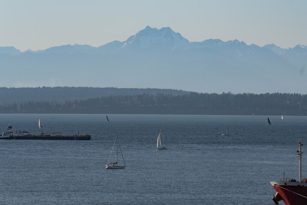 sail boat on Puget Sound with Olympic Mountains in the distance