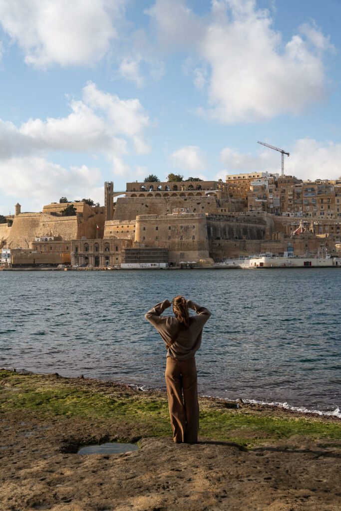 woman enjoying the view of Valletta Malta from the Three Cities
