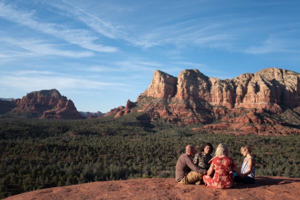 group on a sedona wellness retreat among the red rock mountains