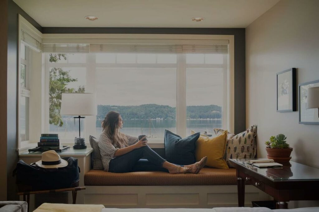 woman relaxing on sofa at Alderbrook Resort Washington