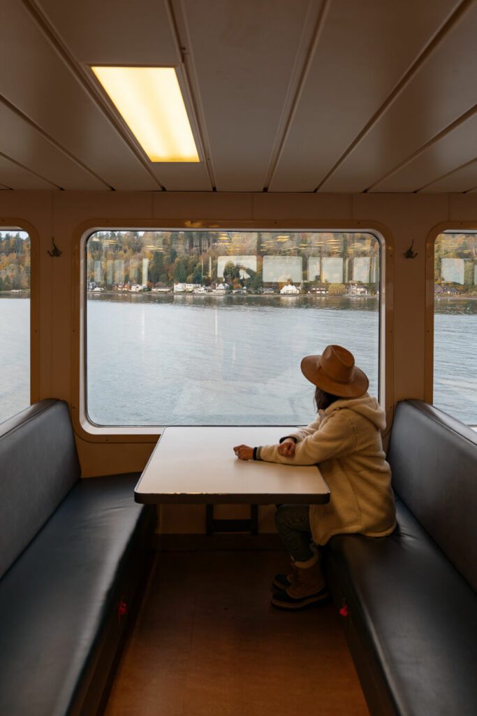 woman on a ferry from seattle to bainbridge island