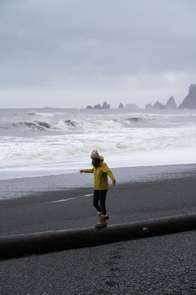woman on Rialto Beach, one best beach hikes in Olympic National Park