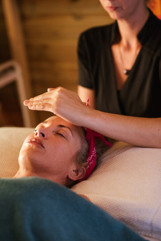 crop masseuse performing reiki massage