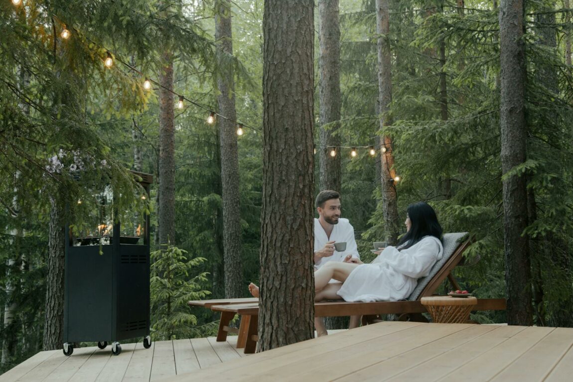 couple looking at each other while sitting on lounge chairs