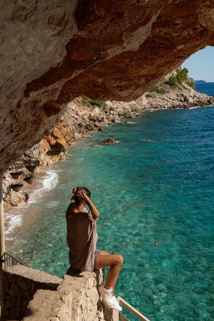 woman on a secret beach outside dubrovnik croatia