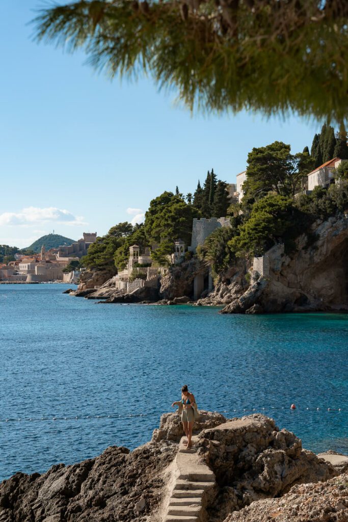 woman on a secret hidden beach cove in Dubrovnik croatia